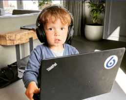 Kid working on levi9 computer
